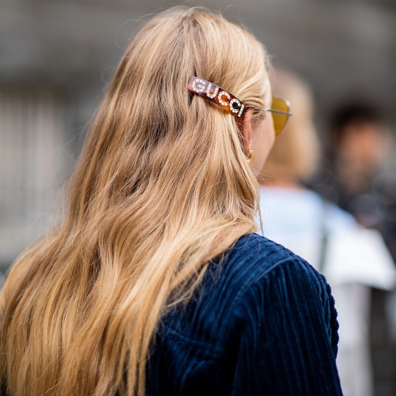 blonde woman with gucci hair clip