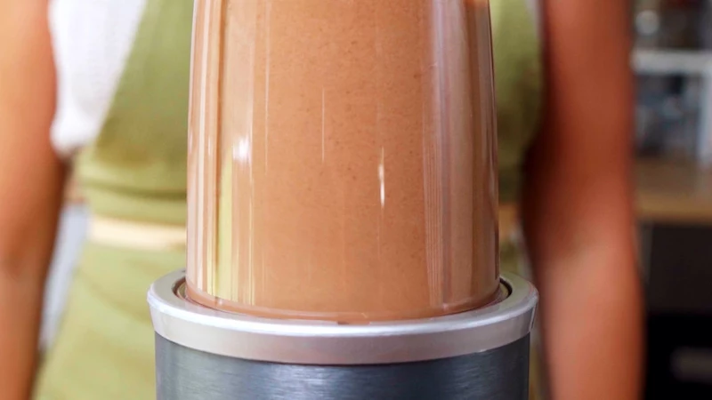 brown mixture liquid in a blender