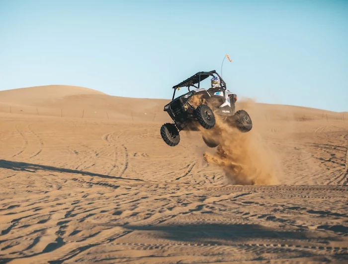 bugie car in the dessert jumping