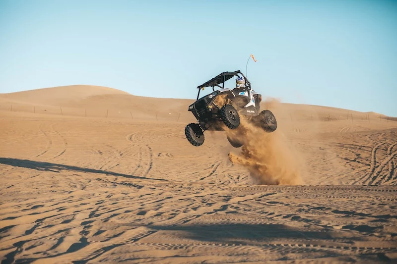 bugie car in the dessert jumping