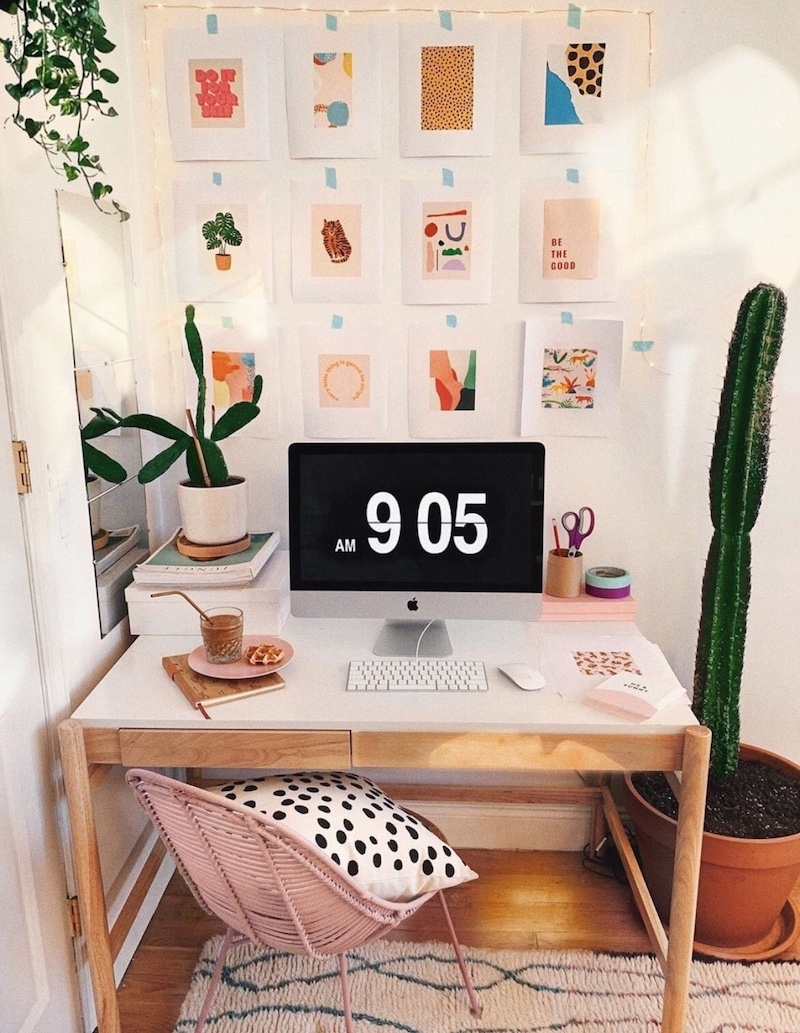 desk with mac and plant