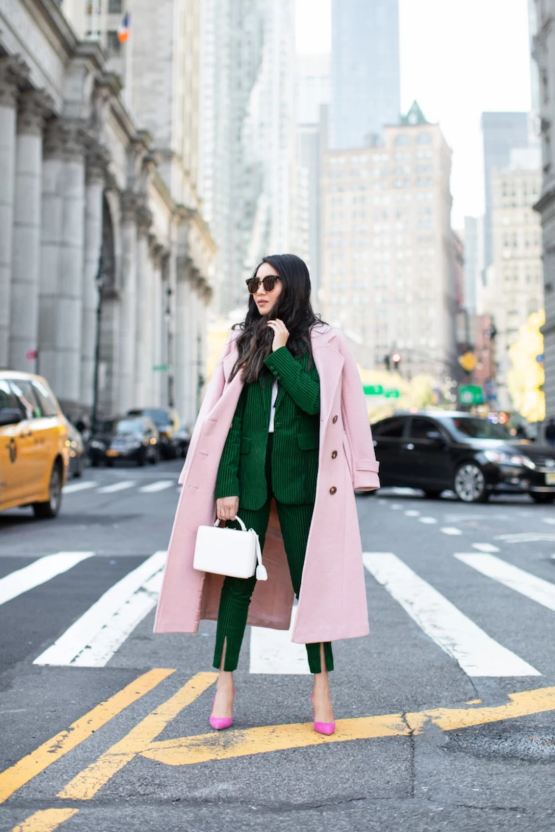 fall fashion colors deep green suit with pink peti coat