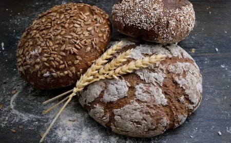 gluten intolerance symptoms three different loafs of bread