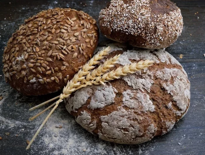 gluten intolerance symptoms three different loafs of bread