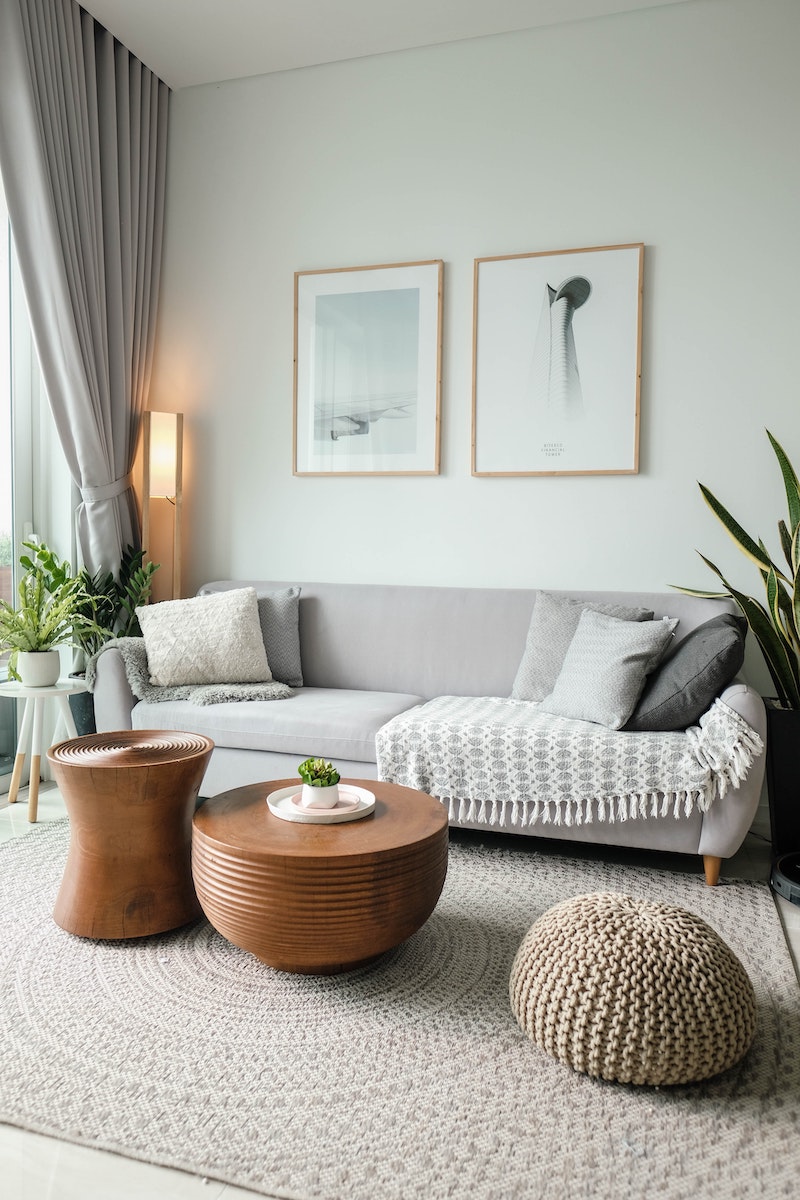 gray couch against the wall with rug