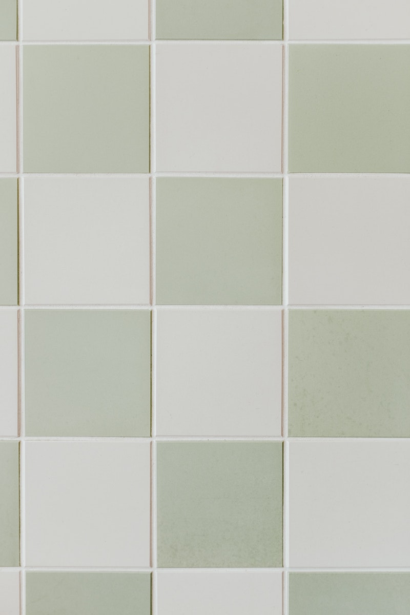 green and white tiles in room