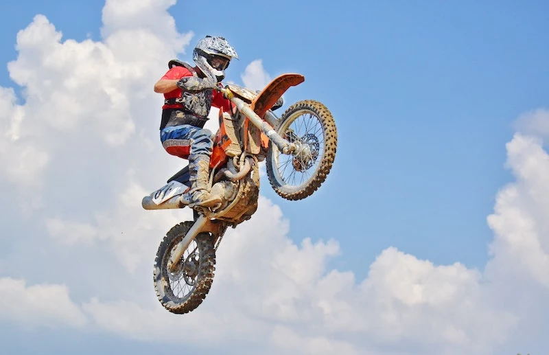 guy on motor bike jumping