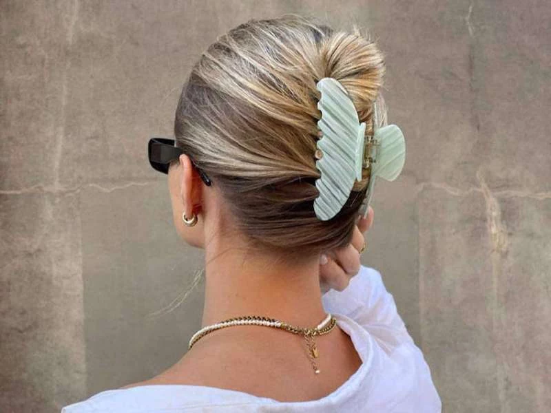 hair accessories for fall blond woman with claw clip on hair