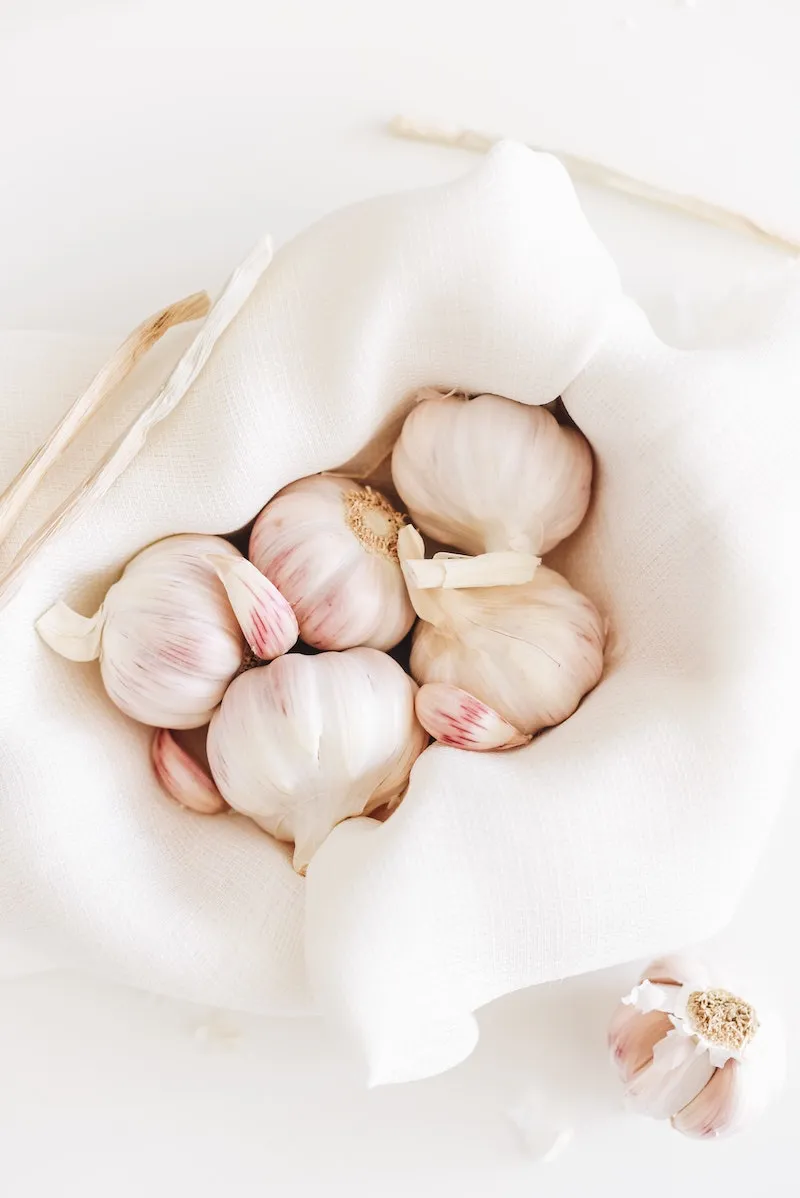 heads of garlic in a white cloth