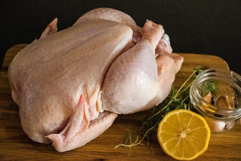 how to defrost chicken raw whole chicken on a cutting board