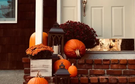 how to prepare your home for autumn front door with orange pumpkin decorations