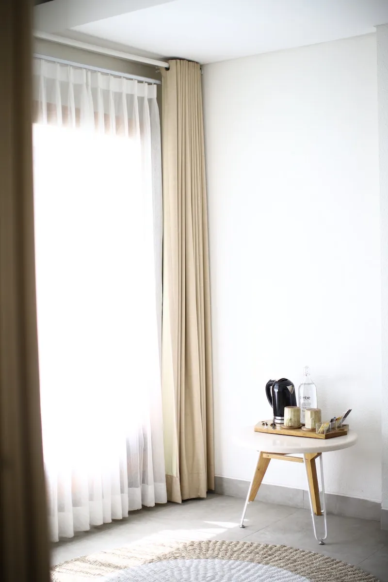 long beinge curtains on window