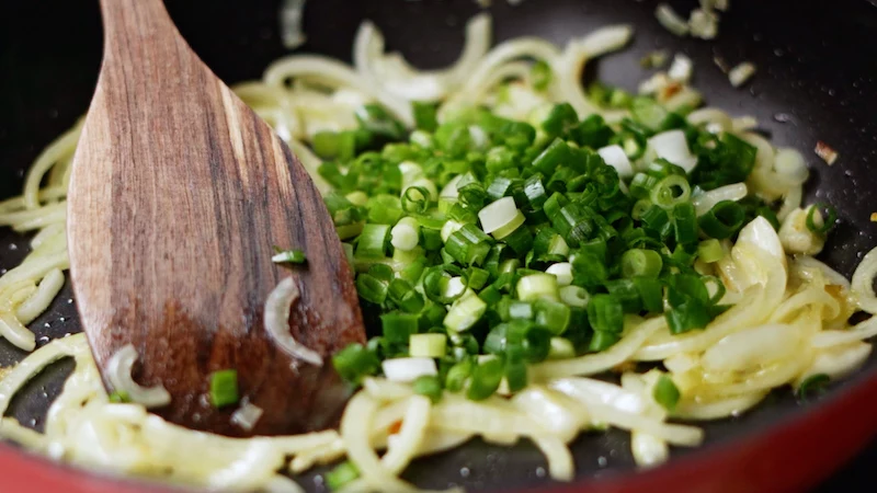 onion and green onion in a pan