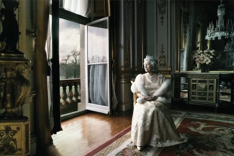 queen elizabeth ii sitting on a throne