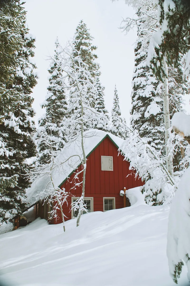 red house under a lot of snow