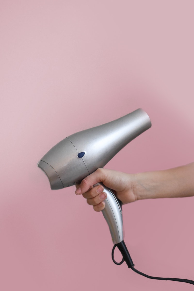 remove water stains from wood gray haor dryer on pink background
