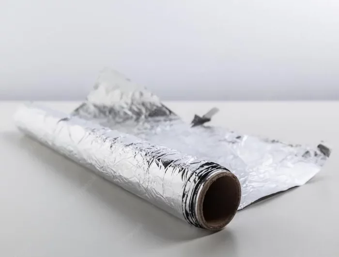 roll aluminum foil isolated white background