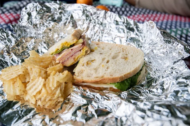 sandwich and chips in aluminum foil