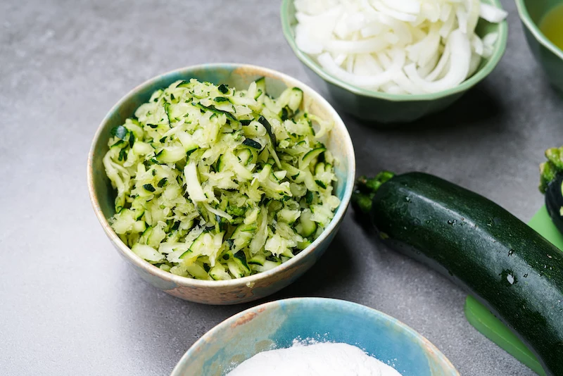 shredded and drained zucchini in a bowl