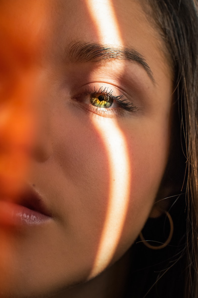 skin cycling womans face in half with green eye