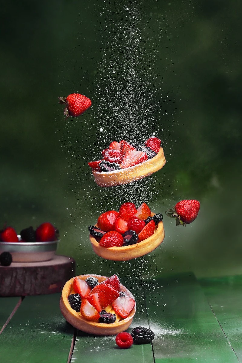 three tartalets falling with powdered sugar