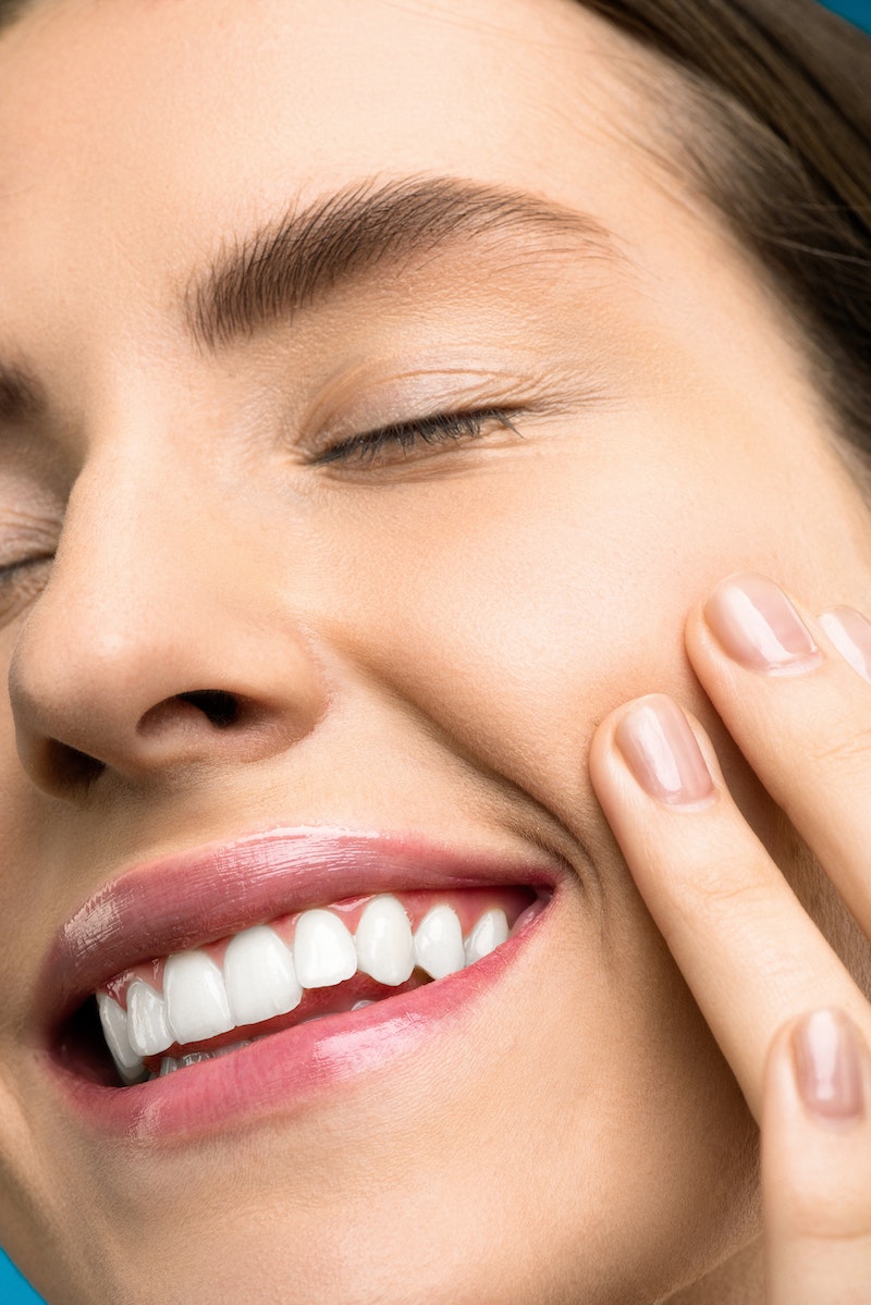 woman smiling with clear skin and white teeth woman smiling with clear skin and white teeth