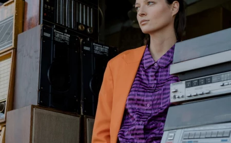 woman with orange suit and purple shirt