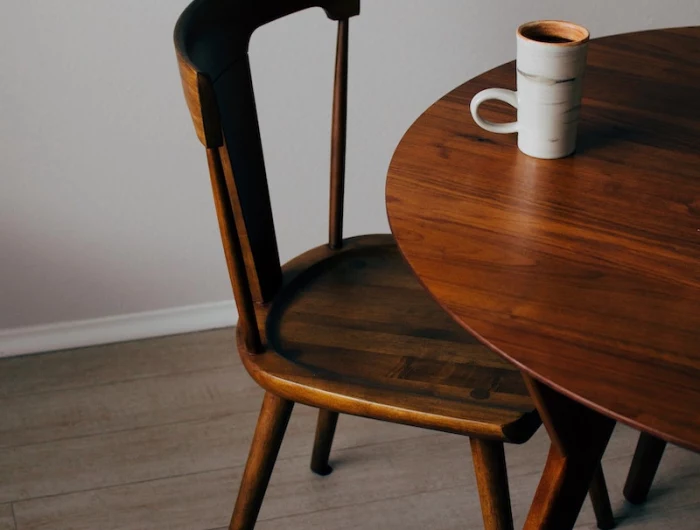 wooden chair and table with cup on table