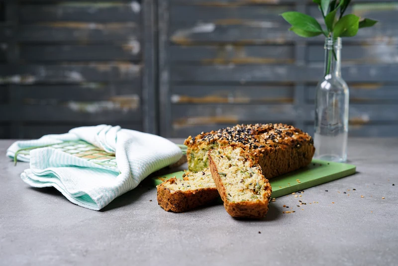 zucchini savory bread with a cut slice