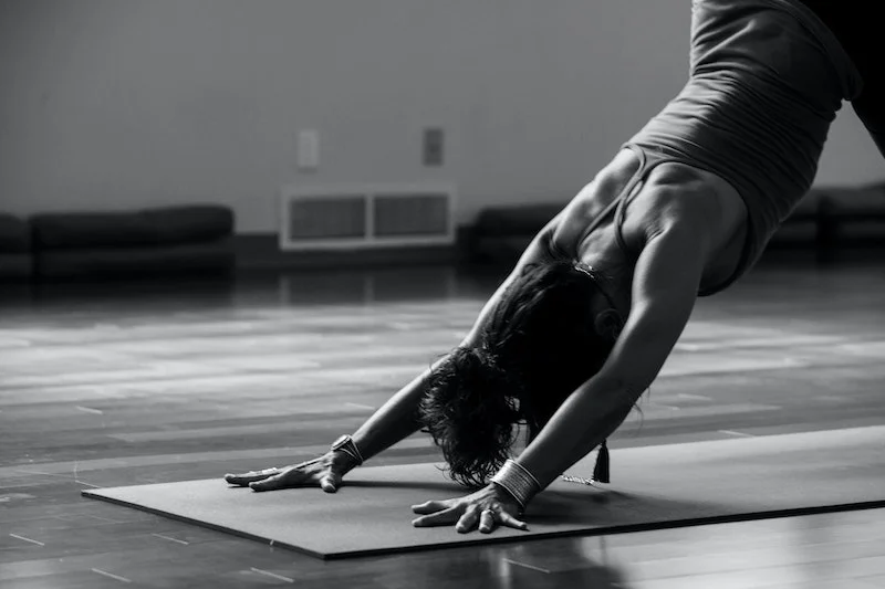 black and white picture of woman stretching