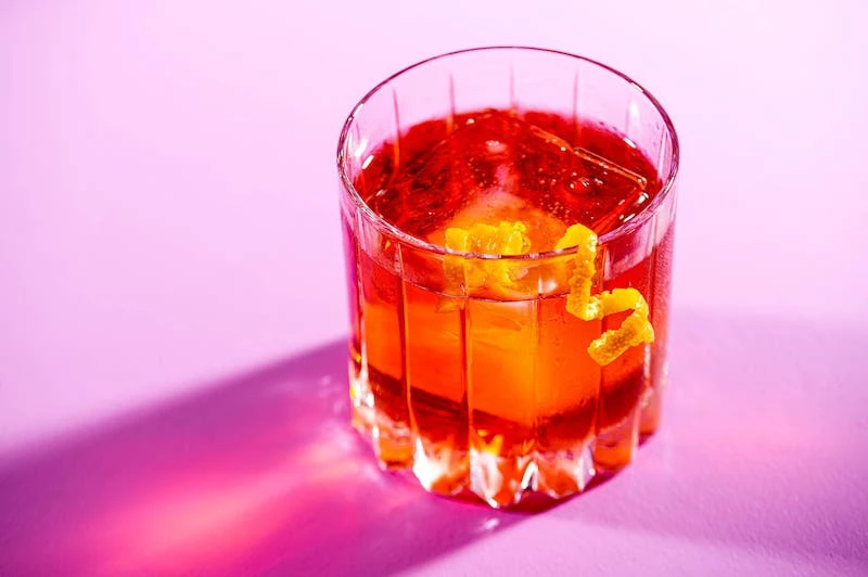classic negroni cocktail on pink background