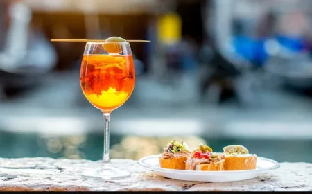cocktail glass on the side of the pool