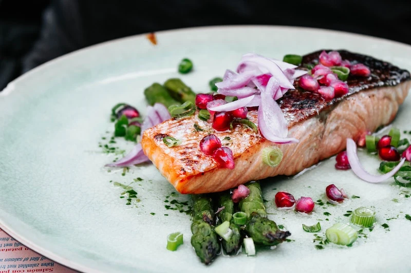 cooked salmon with pomegranet seeds