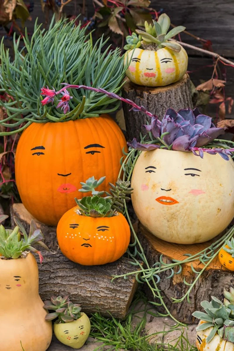 different pumpkins with different faces drawn on
