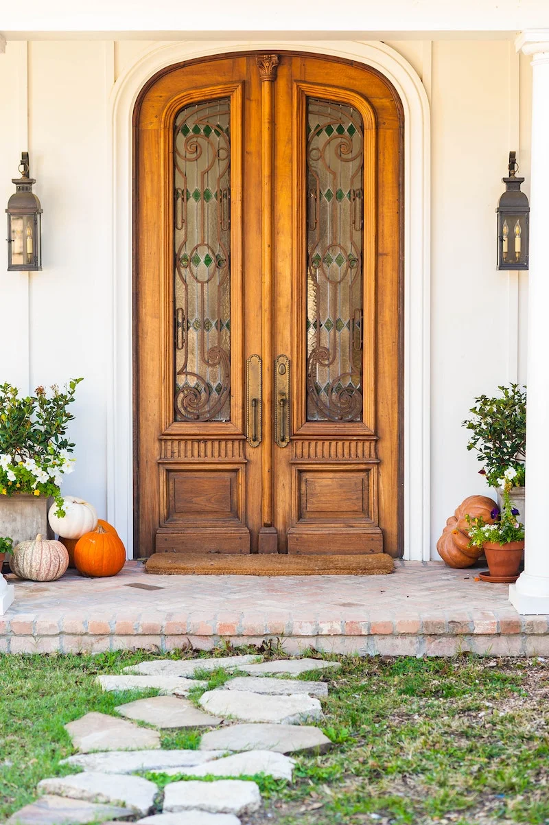 door with some pumpkins outside