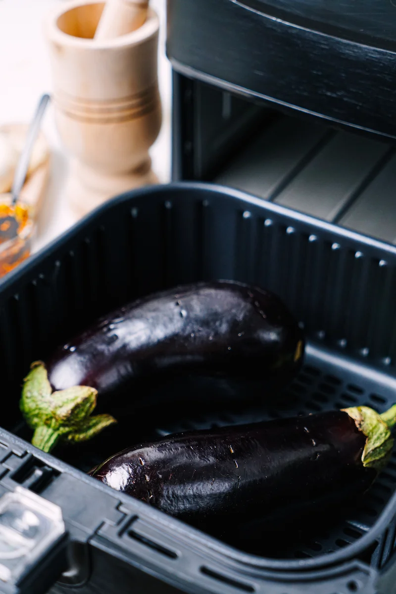 eggplants in an air fryer basket