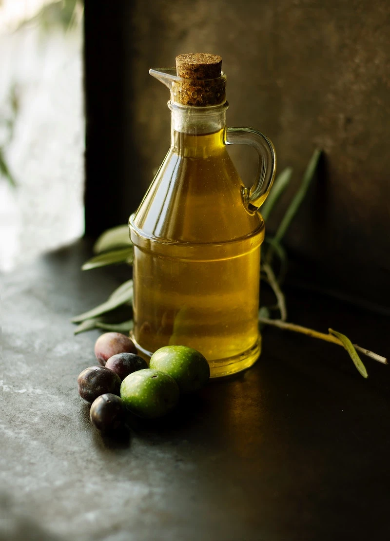 foods everyone over 40 should eat olive oil in a glass container with olives