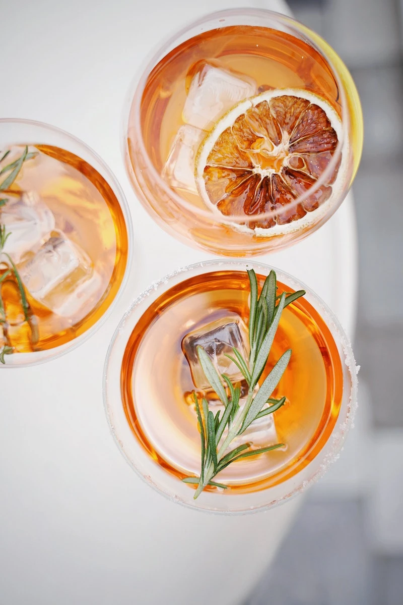glasses of prosecco and garnish of rosemary