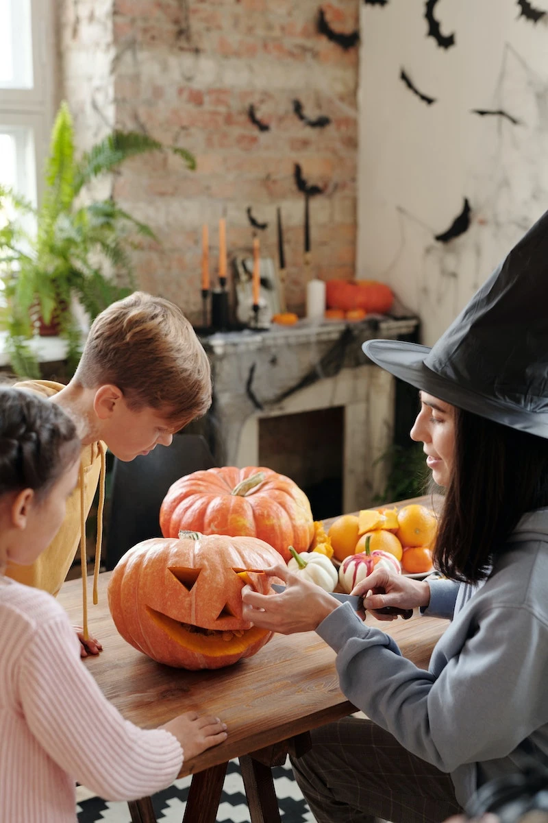 pumpkin carving hacks family carving a pumpkin