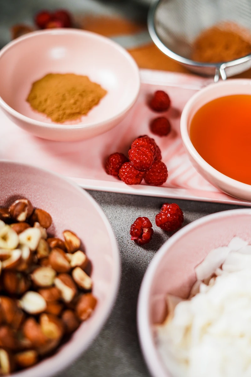 raspberries in between bowls with ingredients