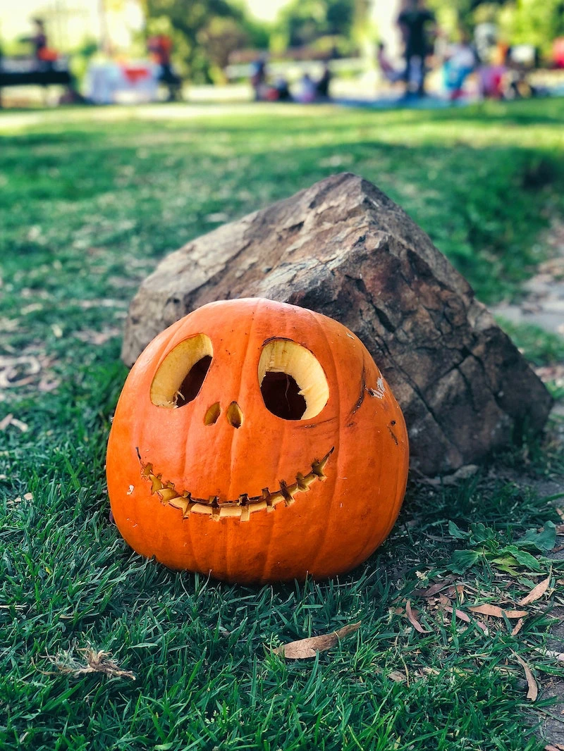 spooky orange carved pumpkin