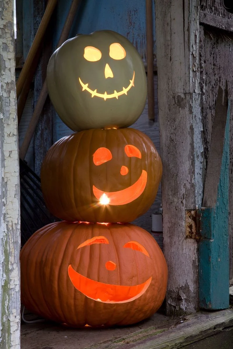 three pumpkins stacked on top of each other