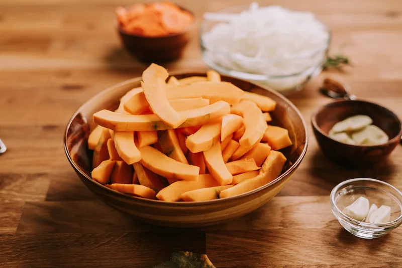 vegan pumpkin soup pumpkin slices in a bowl