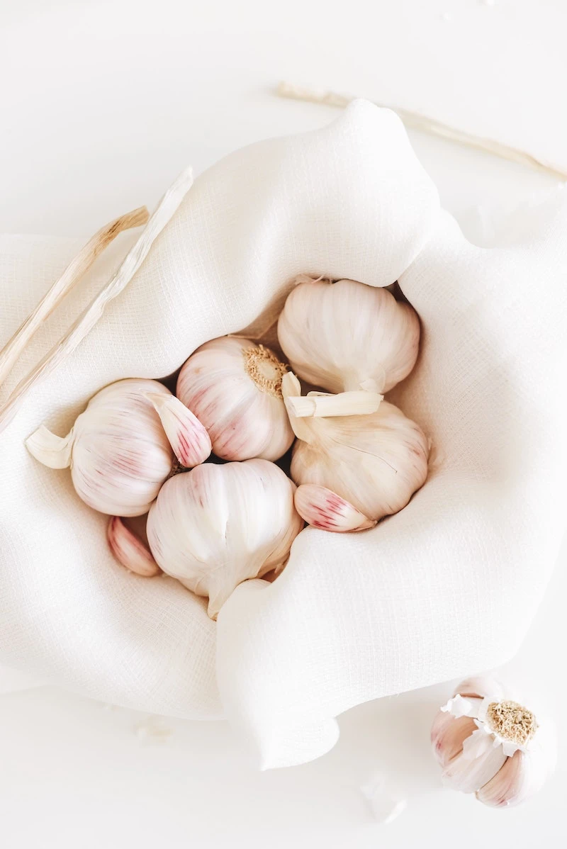 whole garlic in a white cloth