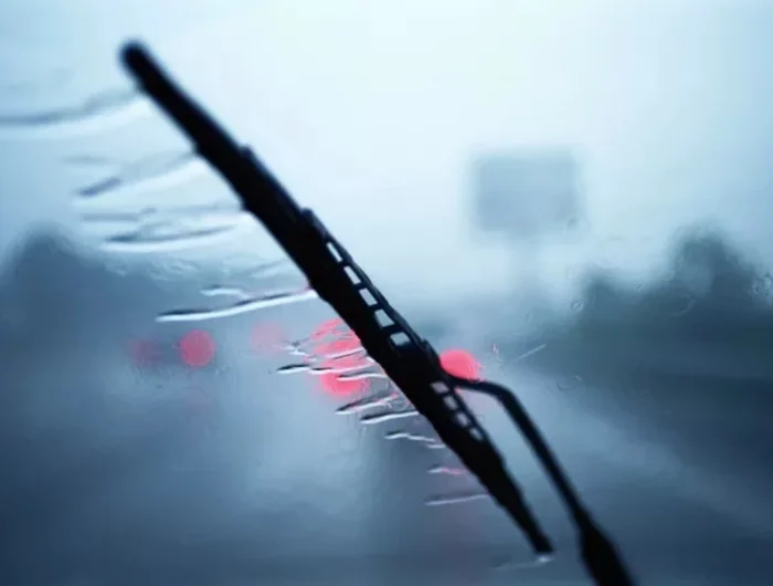 windshield wiper on car in the rain