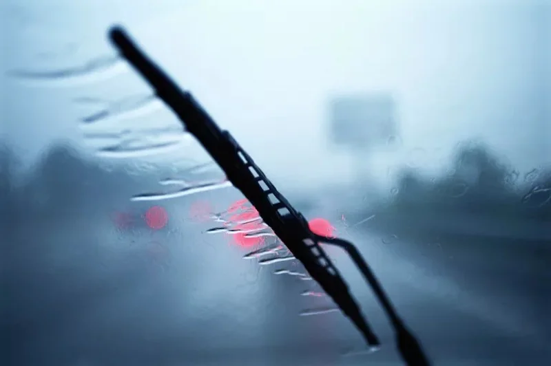 windshield wiper on car in the rain