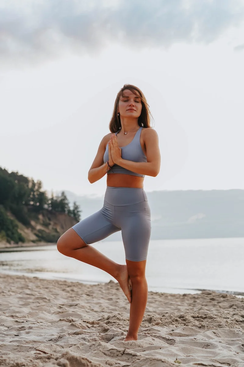 woman holding a standing yoga pose