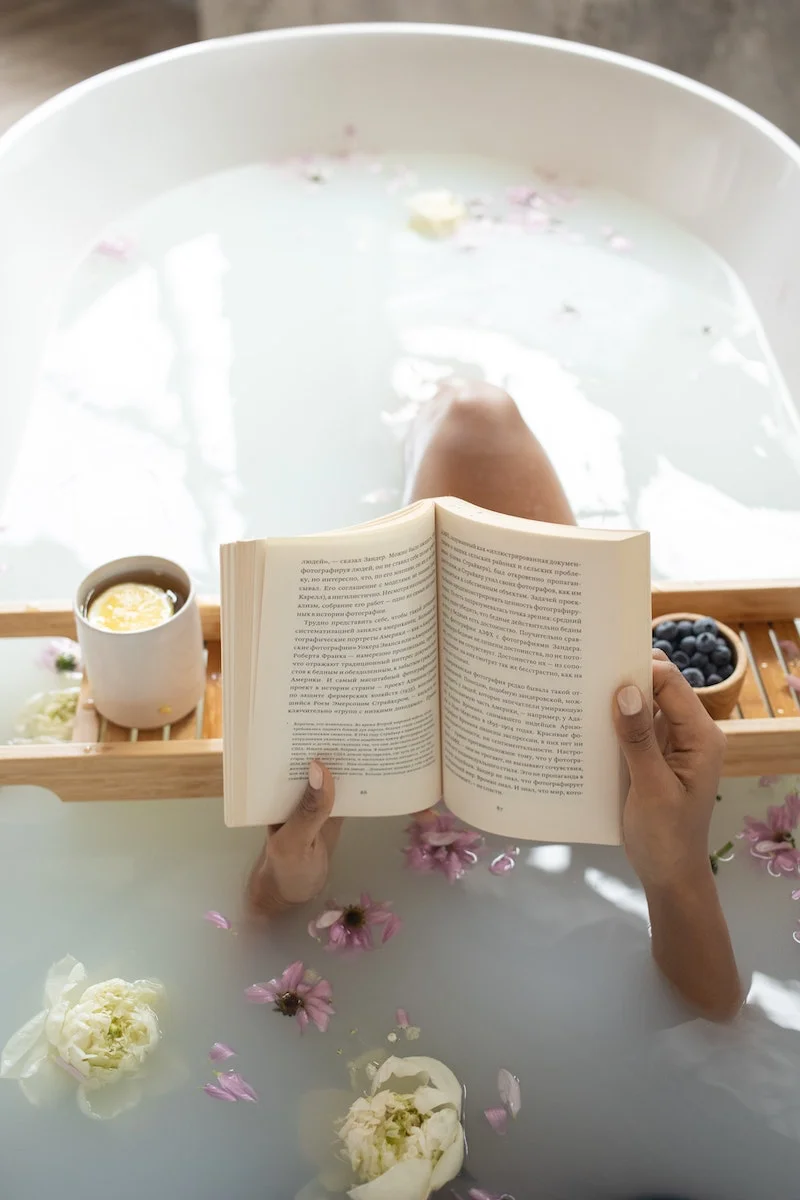 woman reading in milk bath