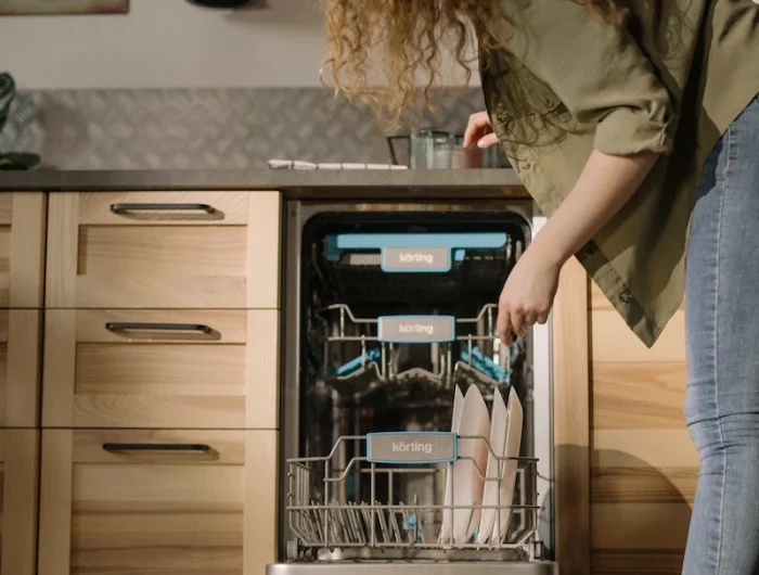 woman using her dishwasher