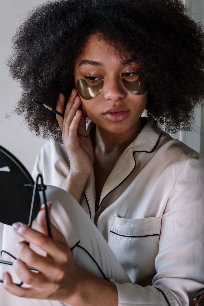 woman with eye patches under her eyes